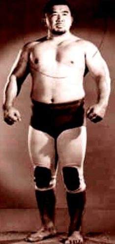 No, it's not "Oddjob" frm "Goldfinger".....